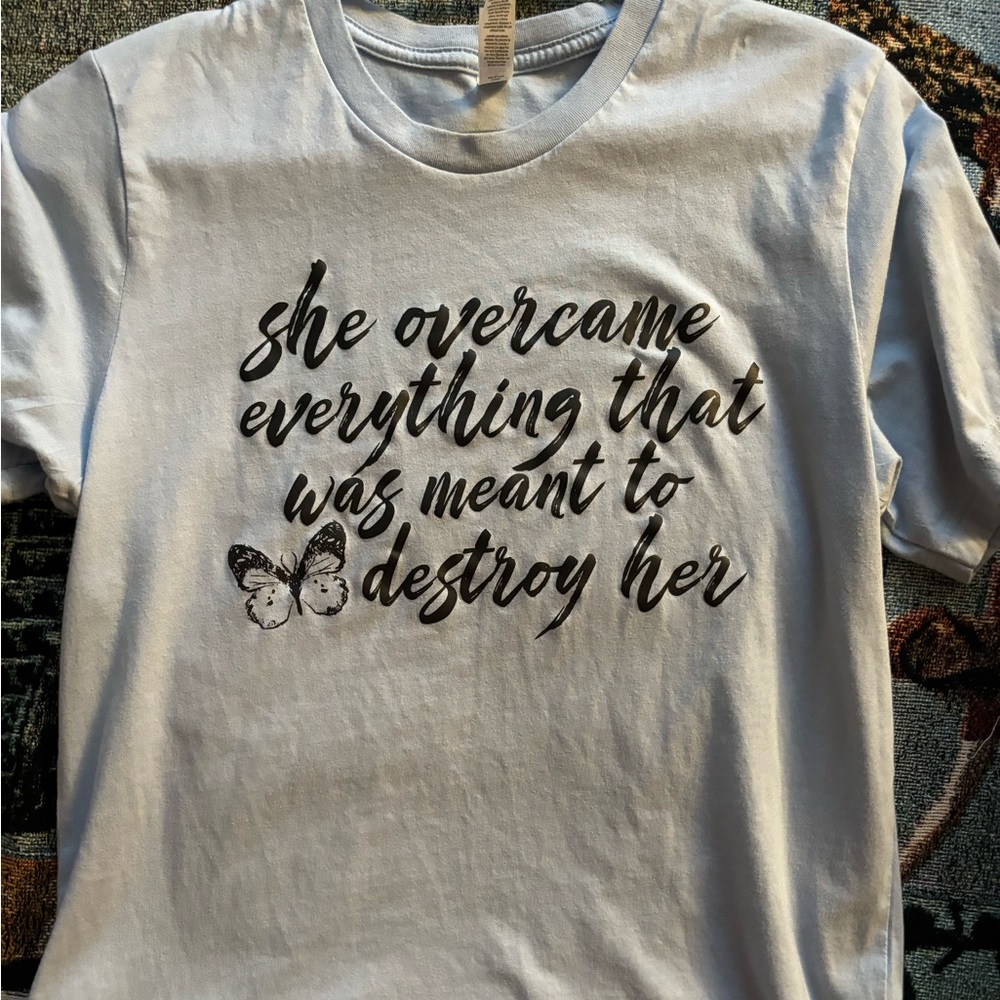 Light blue T-shirt with quote